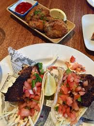 Top with the lettuce, salsa, onions, tomatoes, cucumbers and cilantro. Crumbed Oysters Blackened Snapper Fish Tacos Picture Of The Sandbar Seafood Restaurant Vancouver Tripadvisor
