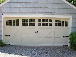 Maybe you would like to learn more about one of these? Double Garage Door That Looks Like Two Doors Garage Door Option Off White Rounded Windows With Grills Fa Garage Door Design Garage Doors Best Garage Doors