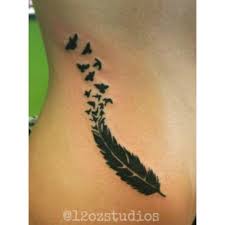 Flying Bird Tattoo On Ribs Beautiful Flowing Black Feather Transforming Into Flying Birds Female Side Hip Rib Tattoo By Rebecca La Norma Bird Tattoo Ribs Hip Tattoo Flying Bird Tattoo