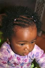 Father feeding 6 months old baby with spoon. Boo Sporting Some Flat Twists A Staple Of Her Early Styles At 11 Months Old Black Baby Girl Hairstyles Black Baby Hairstyles Baby Girl Hairstyles