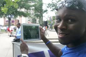 Tianna's dad, Bob, speaks at the rally surrounded…