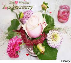 Old man hugging happy wife holding flowers, celebrating marriage anniversary. Wedding Anniversary Flowers Picmix