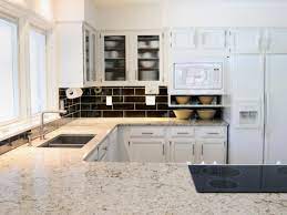 Complimentary countertops for dark cabinets. White Granite Countertops Hgtv
