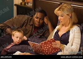 JAE HEAD, QUINTON AARON and SANDRA BULLOCK in THE BLIND SIDE, 2009,  directed by JOHN LEE HANCOCK. Copyright ALCON ENTERTAIMENT