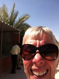 Dog haircut with a tractor in a country setting