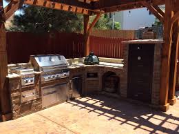 Stainless steel offers greater protection against rust and corrosion while providing an ideal cooking surface. Large Outdoor Kitchen Cabinets With Wood Fired Smoker Green Egg And Gas Grill Located In Centennial Co Hi Tech Appliance