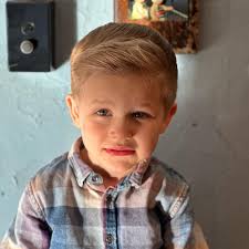 Pic one Archies first visit to the barber with mum Li; pic two Archies most  recent visit to the barbershop; pic three brother Finlay coming up