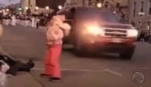 Suv drives through a christmas parade in waukesha, wisconsin,. S7gfq Cwugh4jm