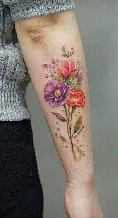 Watercolor flower tattoo on arm | Watercolor flower tattoo arm, Watercolor flower bouquet tattoo, Tattoo art