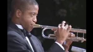 For a guy named Trombone Shorty, he sure is a MONSTER trumpet player ... 18  years old in this clip playing with STYLE beyond his years!!