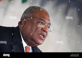 Interim Prime Minister Gerard Latortue, right, embraces Suzy Castor, widow  of Prominent Haitian intellectual and politician Gerard Pierre-Charles,  during his funeral in Port-au-Prince, Haiti, Saturday, Oct.16,2004. He died  of heart failure Sunday,