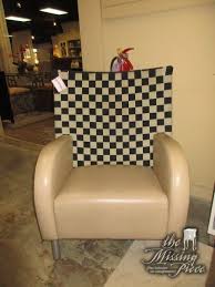 Retro Style Vinyl Chair In Tan With A Black Tan Checkered Back It Has Two Stationary Legs In Front And Two Silver Wheels In Back S Vinyl Chairs Chair Vinyl
