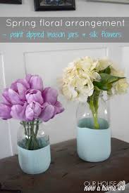 May 11, 2021 · turquoise mason jar aisle decor craft this beautiful arrangement, attach yarn to the rim of the jar, and hang it to the chairs at your next outdoor party. Spring Silk Floral Arrangement And Paint Dipped Mason Jars Our House Now A Home