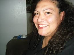 How much wood ash should be spread in a 10x10 foot chicken run?