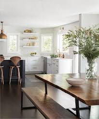 Designer accessories in a modern kitchen. Live Edge Dining Table With Wood And Metal Bench Transitional Dining Room