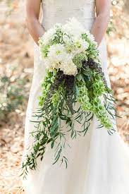 Here lili used white dahlia white brides bouquet. Bells Of Ireland Rustic Wedding Flowers Flower Bouquet Wedding Wedding