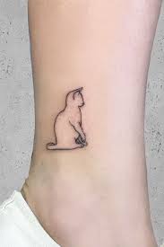 A Cat Tattoos Guide To Help You Choose Cat Tattoo Simple Minimalist Cat Tattoo Kitten Tattoo