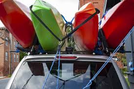 Begin by standing with the kayak on the ground on edge against your shins with the cockpit facing out. How To Haul A Kayak A Practical Guide To Kayak Transport