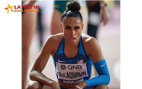 Los angeles — beneath blue skies and palm trees, sydney mclaughlin walks through the ucla campus with a white backpack over her shoulders and oversized headphones covering her ears. Os9gcwtwdj Utm