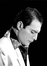 Well, maybe it doesn't have much to do with Freddie, but the fact remains  that at least one of the two photos (the black and white one) is extremely  famous, practically an