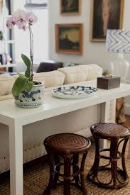 Design Manifest White Parsons Sofa Table With Rattan Stools Decor Parsons Table Home Decor