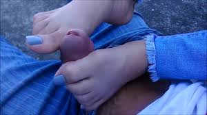 Chick with sexy blue toe nails delivering a hot footjob in public
