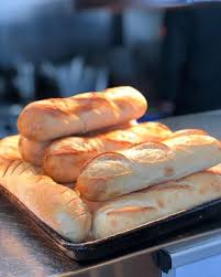 Fresh Baked Artisan Bread With Tzatziki Sriracha Pesto Feta And Whole Olive Blend Mint29 Dearborn Food Artisan Bread Food Freshly Baked