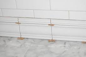 So here is my dilemma: Tile Detail At Floor Using A Tile Chair Rail Molding And Liner To Make A Baseboard Bathroom Baseboard Tile Baseboard Master Bath Tile