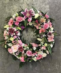The meaning behind funeral flowers. Traditional Open Wreath Ring Pink Funeral Flowers Funeral Flower Arrangements Funeral Flowers Diy