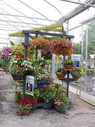Vertical Merchandising Garden Center I Liked This Display Because Of Its Peculiar Shape It Also Allows F Garden Projects Garden Center Displays Garden Center