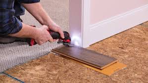 A power drill with auger drill bits. How To Install A Laminate Floor