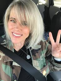 People ask me how I went from color to silver. I cut it short and let it  grow out. It took a year. It's empowering! I love it.