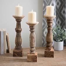 The voluminous silhouettes and carved ridges were crafted from mango tree wood. Reclaimed Wooden Banister Candle Holders Set Of 3 Kirklands