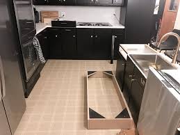 I suggest that, before painting, one might want to take a better look at what is beneath the current finish. How To Paint Black Kitchen Cabinets Our Kitchen Renovation