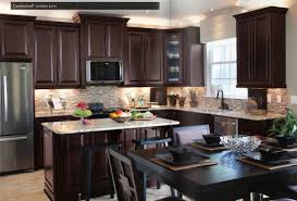 Santa Cecilia Countertop With Cherry Java Cabinets And Matchstick Mosaic Backsplash Dark Brown Kitchen Cabinets Brown Kitchen Cabinets Classic Kitchen Cabinets