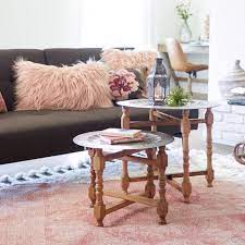 We have two young girls who like to do play and do art projects on the coffee table. Metal And Wood Arya Table Set Of 2 V6 End Tables Coffee Table Table