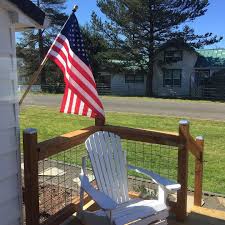 Flag Stiffy On Instagram Repost Salvagebythesea The View From My Kitchen Window Americanflag Adirondackch Adirondack Chair Beach Cottages Ocean Park