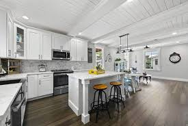 Farmhouse kitchen with stained and painted custom cabinetry. Shiplap Kitchens Design Ideas Designing Idea