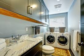 utility room with green cabinets
