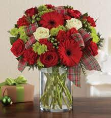 The best flowers to send for christmas are ones that are festive and get you in the holiday spirit! Festive Fanfare Bouquet Arrangement Rose Arrangements Christmas Rose Flower Arrangements