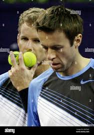 Mark Knowles, left, and Daniel Nestor share strategy during the men's  double final match against Simon Aspelin and Julian Knowle for the 2007  Tennis Masters Cup Shanghai held in Shanghai, China, Sunday,