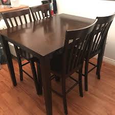 It includes a fixed table and four chairs, all made from solid and engineered wood in a sleek black finish. Find More Solid Wood Bar Height Table And 4 Chairs For Sale At Up To 90 Off