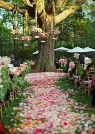 Instead of traditional vases, have your florist display the flowers using terra cotta pots, wooden baskets, galvanized pails, or even cute vintage watering cans. 40 Stunning Spring Wedding Aisle Decor Ideas Happywedd Com Wedding Aisle Outdoor Outdoor Wedding Wedding Tree Decorations