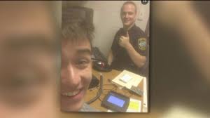 Arrested man takes selfie at police station