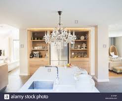 chandelier hanging over luxury kitchen