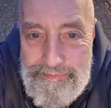 Volunteers paint fence at Seaman's Inn restaurant