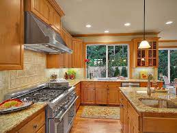 Giallo Ornamental Granite Countertops Pictures Cost Pros And Cons Honey Oak Cabinets Kitchen Remodel Light Oak Cabinets With Granite