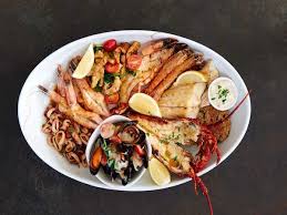 Popular with families, this surf beach is famous for its row of colourfully painted victorian bathing chalets. Cape Town Fish Market Grandwest Restaurant In Cape Town Eatout