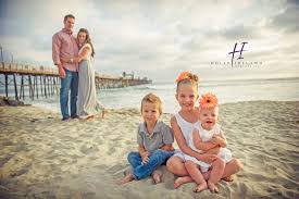 If you are taking the photoshoot to the beach, choose muted tranquil hues. Oceanside Pier Family Photos