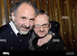 Producer Peter Rommel (L) and actor Milan Peschel smile during the premier  of the movie 'Halt auf freier Strecke' ('Stop